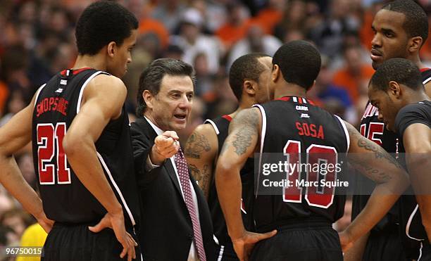 Coach Rick Pitino of the Louisville Cardinals talks to his team during the game against the Syracuse Orange at the Carrier Dome on February 14, 2010...
