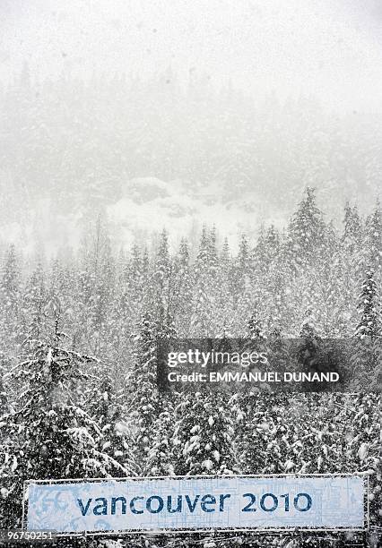 Heavy snow falls February 16, 2010 at the Whistler Creekside Alpine skiing venue of the Vancouver 2010 Winter Olympics. International Ski Federation...