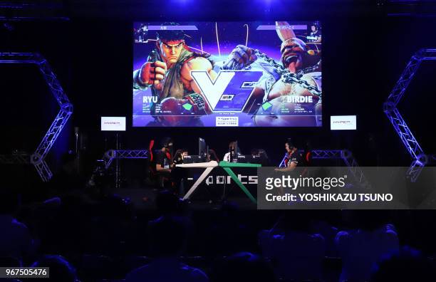 Players fight "Street Fighter V" on their video games for the demonstration of e-Sports at the Tokyo Game Show 2017 in Chiba, suburban Tokyo on...