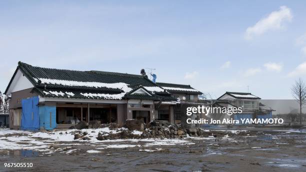 One year after the earthquake and resulting tsunami this Yuriage neighborhood, a home is being rebuilt, and the gardens have been planted on March...