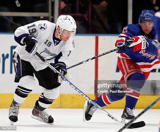 Stephane Veilleux of the Tampa Bay Lightning skates with the puck against the New York Rangers during an NHL game at Madison Square Garden on...