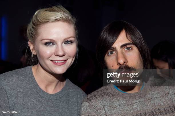 Actress Kirsten Dunst and Jason Schwartzman along the front row at Rodarte Fall 2010 during Mercedes-Benz Fashion Week at on February 16, 2010 in New...