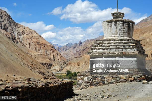 India, Ladakh, Markha Valley, white stupa in scenic landscape of the Himalayas with Markha stream river.