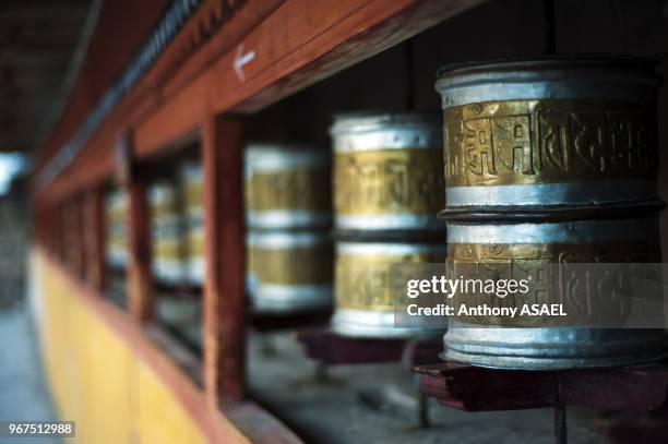 India, Ladakh, Hemis, prayer wheels in Hemis Monastery constructed out of wood.