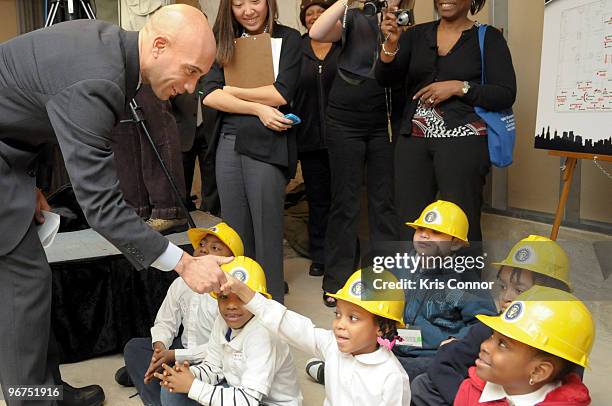 Washington DC Mayor Adrian M. Fenty shakes hands with students from the Clevend School, located in Washington DC during the unveiling ceremony for...