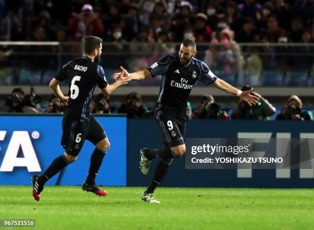 Spain's Real Madrid karim Benzema is celebrated from his teammate Nacho Fernandez as he scores a goal against Meixo's Club America diring the...