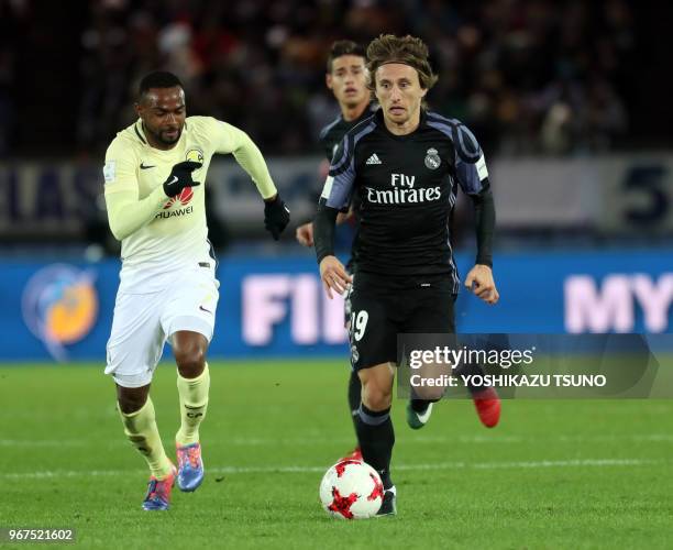 Spain's Real Madrid Luka Modric fights the ball against Meixo's Club America player diring the semi-final of the FIFA Club World Cup in Yokohama,...