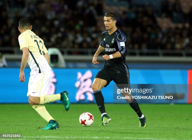 Spain's Real Madrid Cristiano Ronaldo fights the ball against Meixo's Club America Pablo Aguilar diring the semi-final of the FIFA Club World Cup in...