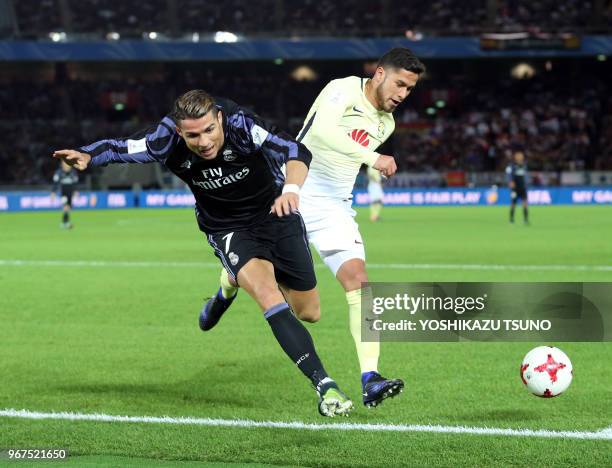 Spain's Real Madrid Cristiano Ronaldo fights the ball against Meixo's Club America player diring the semi-final of the FIFA Club World Cup in...