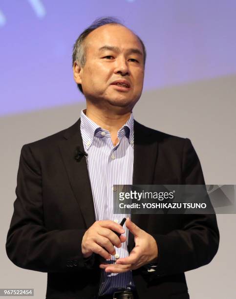 Japanese communication giant Softbank chairman Masayoshi Son delivers a keynote speech at the company's convention Softbank World in Tokyo on July...