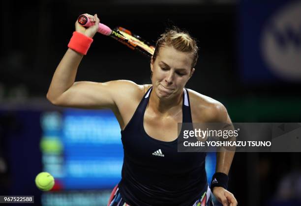 Anastasia Pavlyuchenkova of Russia smashes the ball to the court as she lost a key point during the second round of the Toray Pan Pacific Open tennis...