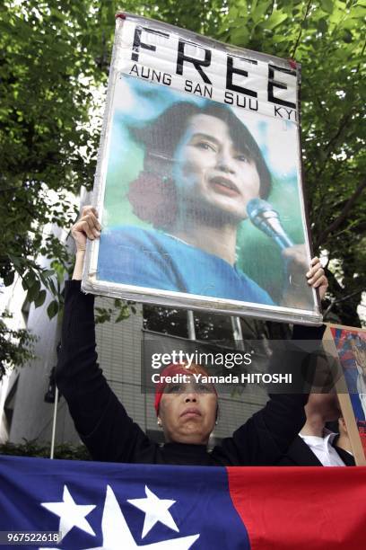 May 15, 2009 Tokyo A Myanmar citizen living in Japan holds a portrait of Aung San Suu Kyi during a rally in front of the Myanmar embassy in Tokyo on...