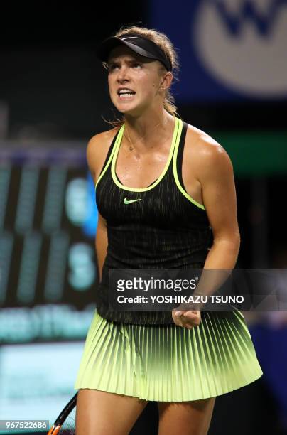 Elina Svitolina of Ukraine shouts as she won a key point during the second round of the Toray Pan Pacific Open tennis championships in Tokyo on...