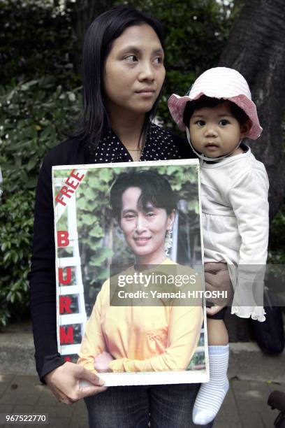 May 15, 2009 Tokyo A Myanmar citizen living in Japan holds a portrait of Aung San Suu Kyi during a rally in front of the Myanmar embassy in Tokyo on...