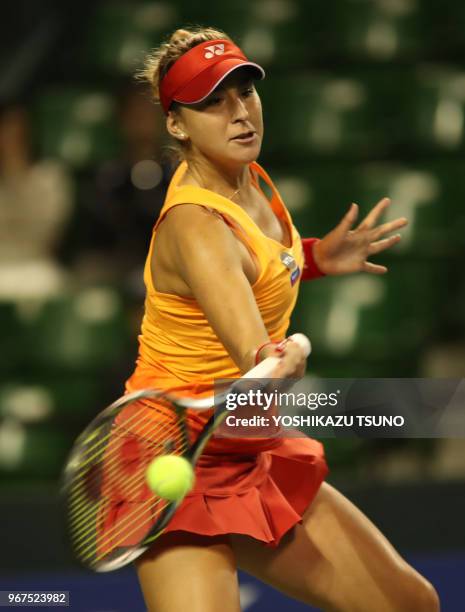 Belinda Bencic of Switzerland returns the ball during the first round of the Toray Pan Pacific Open tennis championships in Tokyo on September 20,...