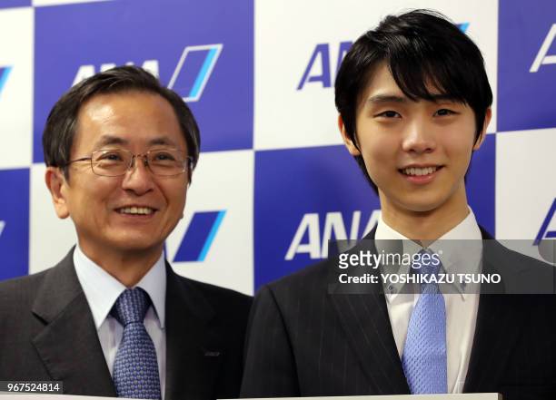 Olympic figure skating gold medalist Yuzuru Hanyu displays certification papers of Guinness World Record at All Nippon Airways headquarters on August...