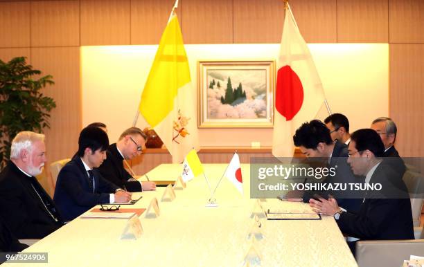 Most Reverend Archbishop Paul Gallagher of Vatican City State talks with Japanese Foreign Minister Fumio Kishida at Kishida's office in Tokyo on...