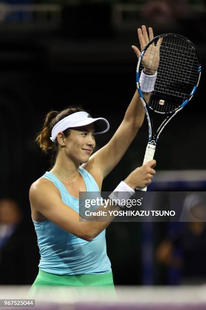 Garbine Muguruza of Spain reacts to audience during the second round of the Toray Pan Pacific Open tennis championships in Tokyo on September 22,...