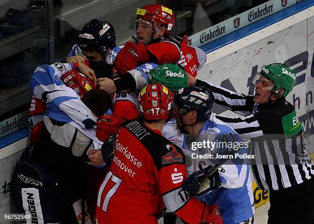 Players of Hannover and Straubing fight after Justin Mapletoft of Straubing scored his team's third goal during the DEL match between Hannover...