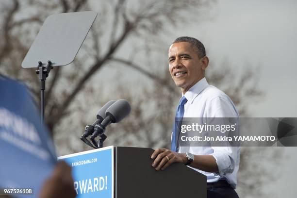 An exuberant President Barack Obama greets supporters on October 24, 2012 in Denver's City Park at one his six states battleground tour during the...