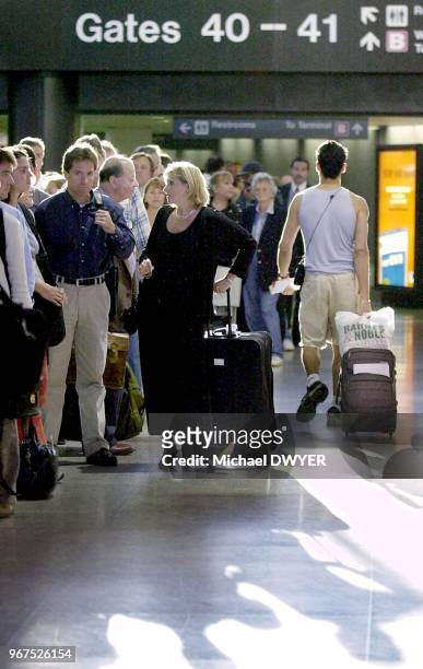 Long line of passengers waits to pass through a security check point Wednesday, Sept. 26 at Logan International Airport in Boston.