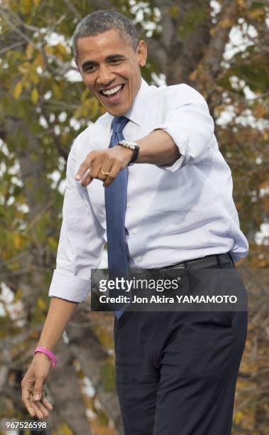 An exuberant President Barack Obama greets supporters on October 24, 2012 in Denver's City Park at one his six states battleground tour during the...