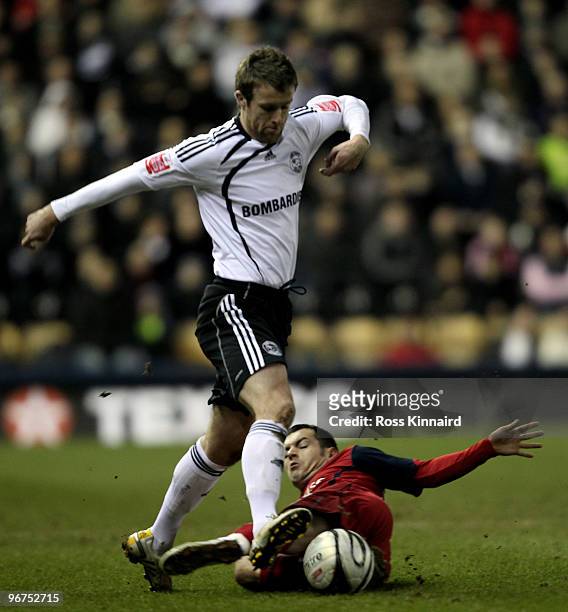 Michael Tonge of Derby is challenged by Ross Wallace of Preston during the Coca Cola Championship match between Derby County and Preston North End at...