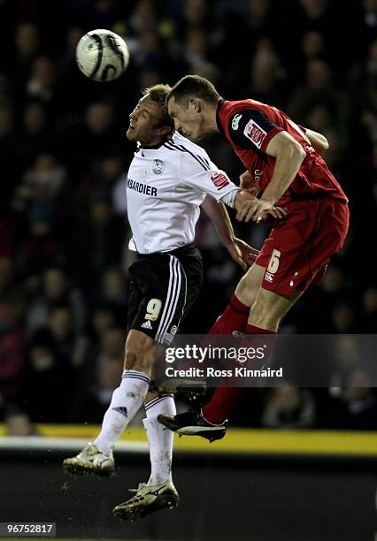 Rob Hulse of Derby is challenged by Neil Collins of Preston during the Coca Cola Championship match between Derby County and Preston North End at...