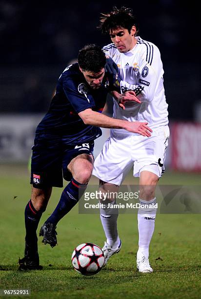 Kaka of Real Madrid is tackled by Jeremy Toulalan of Lyon during the UEFA Champions League round of 16 first leg match between Lyon and Real Madrid,...