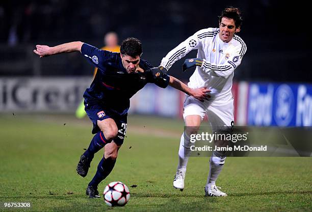 Kaka of Real Madrid is tackled by Jeremy Toulalan of Lyon during the UEFA Champions League round of 16 first leg match between Lyon and Real Madrid,...