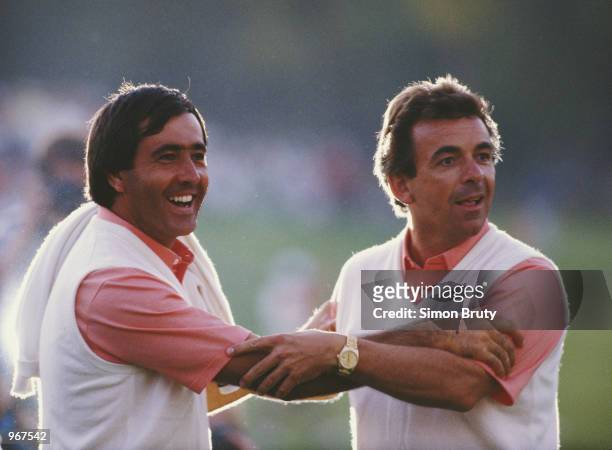 Seve Ballesteros of the European team celebrates with captain Tony Jacklin during the 27th Ryder Cup Matches on 26th September 1987 at the Muirfield...