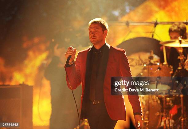 Tom Meighan of Kasabian performs on stage during The Brit Awards 2010, at Earls Court One on February 16, 2010 in London, England.