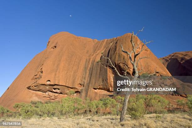 Uluru, also known as Ayers Rock, is a large sandstone rock formation in the southern part of the Northern Territory, central Australia. It lies 335...