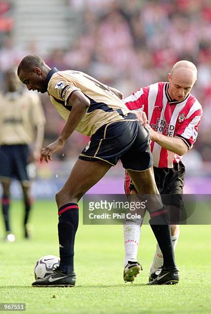 Patrick Vieira of Arsenal is tackled by Chris Marsden of Southampton during the FA Barclaycard Premiership match played at St Mary's, in Southampton,...