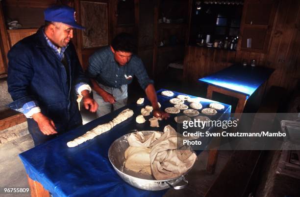 Two workers prepare lunch in the Flores de Los Andes Lapis Lazuli mine, located at 3,700 meter high in the Andes, on April 1 near Ovalle, Northern...