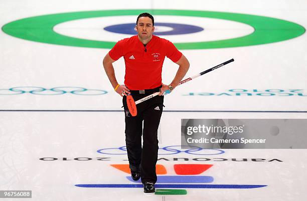 Skip David Murdoch of Great Britain and Northern Ireland reacts to his throw during the men's curling round robin game between Great Britain and...