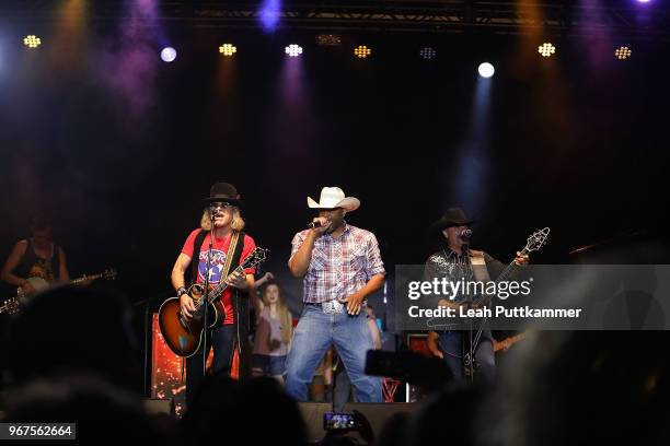 Big Kenny and Cowboy Troy, and John perform at the 8th Annual Music City Gives Back concert at Ascend Park on June 4, 2018 in Nashville, Tennessee.