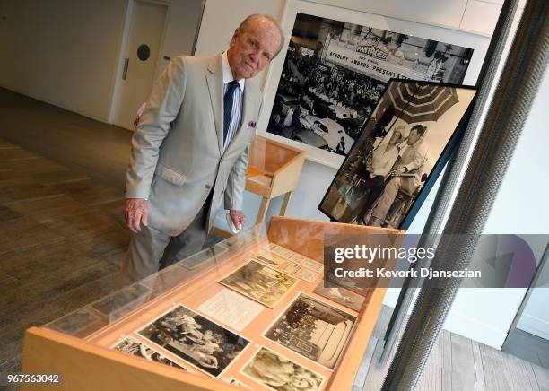 George Stevens, Jr., filmmaker and founder of the American Film Institute, looks at photographs and papers from the Stevens Family collection during...