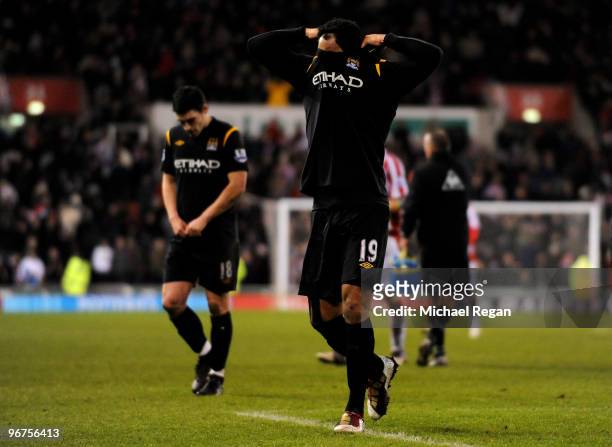 Joleon Lescott and Gareth Barry walk off after the Barclays Premier League match between Stoke City and Manchester City at the Britannia Stadium on...