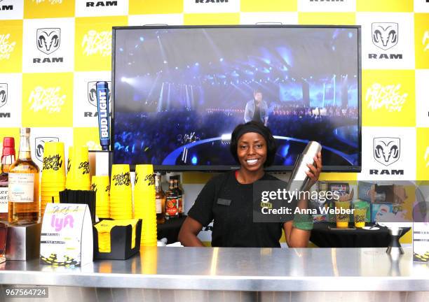 Bartender serves drinks during Ram Trucks presents Drive: Artists to Watch @ the CMT Music Awards at TopGolf Nashville on June 4, 2018 in Nashville,...