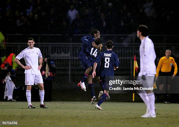 Jean 11 Makoun of Lyon celebrates his goal with Sidney Govou during the UEFA Champions League round of 16 first leg match between Lyon and Real...