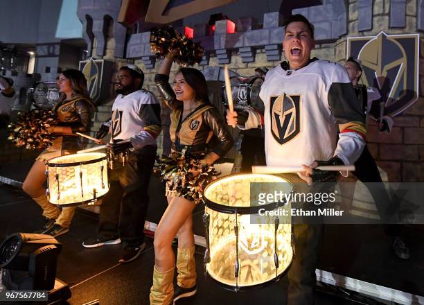 Members of the Vegas Golden Knights Knight Line Drumbots and the Vegas Golden Knights Golden Aces perform in the Castle during a Golden Knights road...