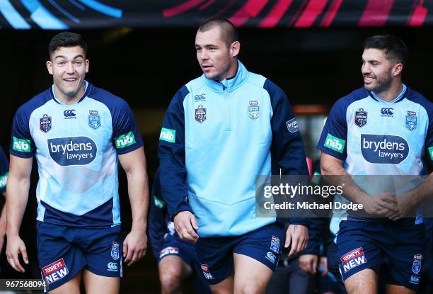 Nick Cotric , Dean Klemmer and James Tedesco walk out during a New South Wales Blues State of Origin Captain's Run at the Melbourne Cricket Ground on...