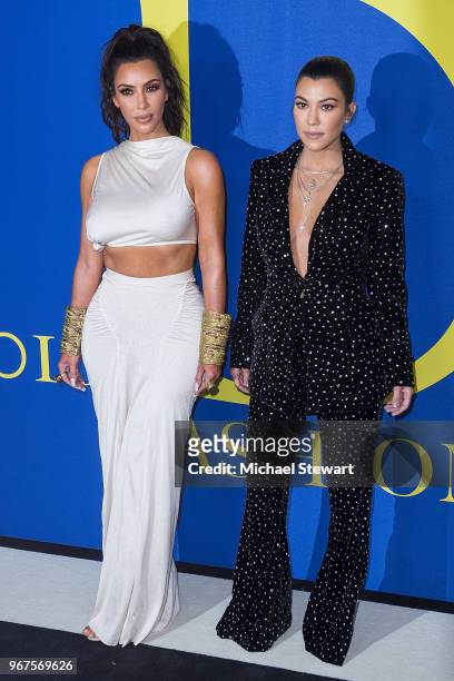Kim Kardashian and Kourtney Kardashian attend the 2018 CFDA Fashion Awards at Brooklyn Museum on June 4, 2018 in New York City.
