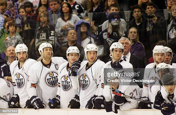 Members of the Edmonton Oilers watch closely during shootout overtime as a teammate takes his turn turn on a shootout attempt against the Los Angeles...
