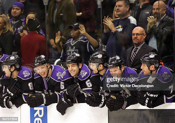 Drew Doughty, Jack Johnson, Sean O'Donnell and Davis Drewiske, Matt Greene and Rob Scuderi of the Los Angeles Kings smile and look on during shootout...