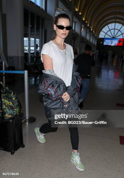 Behati Prinsloo is seen at LAX on June 04, 2018 in Los Angeles, California.