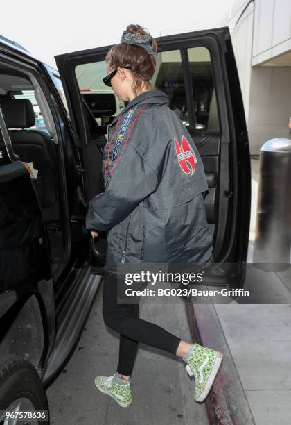 Behati Prinsloo is seen at LAX on June 04, 2018 in Los Angeles, California.