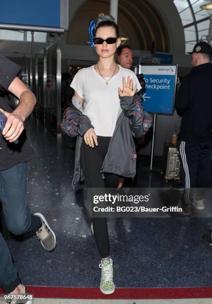 Behati Prinsloo is seen at LAX on June 04, 2018 in Los Angeles, California.