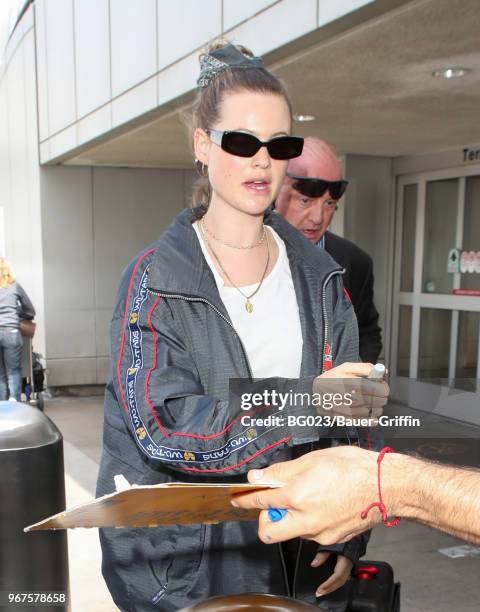 Behati Prinsloo is seen at LAX on June 04, 2018 in Los Angeles, California.